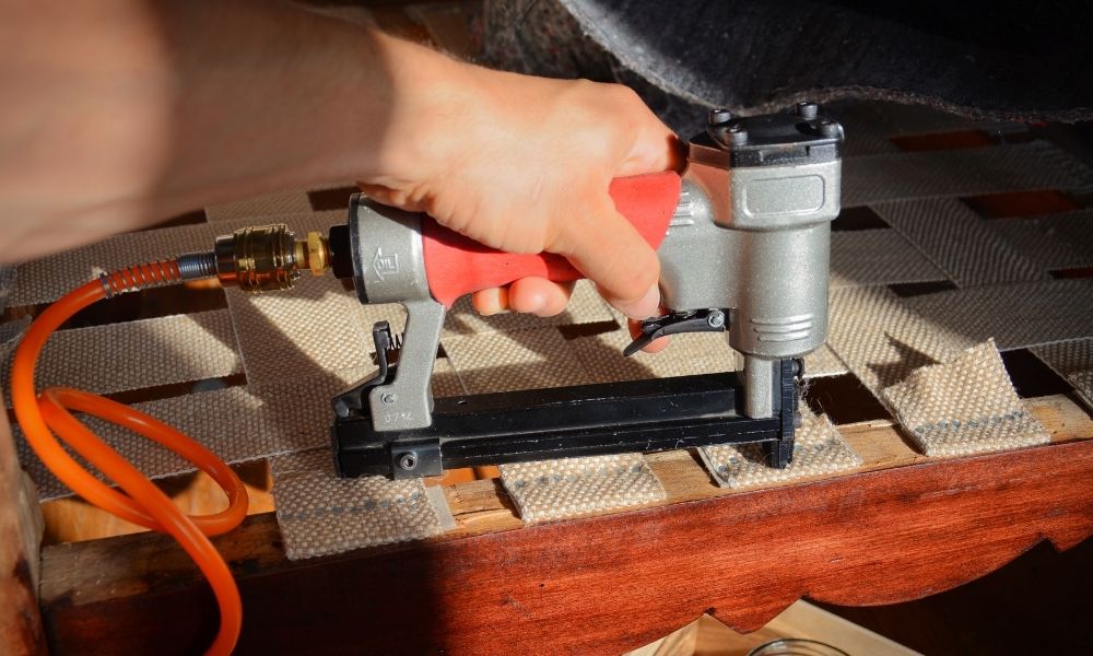 Stapling upholstery.